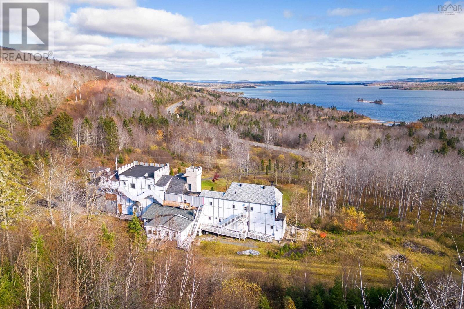 The view from the back is not as castle-like but the property (163 acres!) is in a pretty nice spot and has private access to Bras d'Or Lake. - realtor.ca