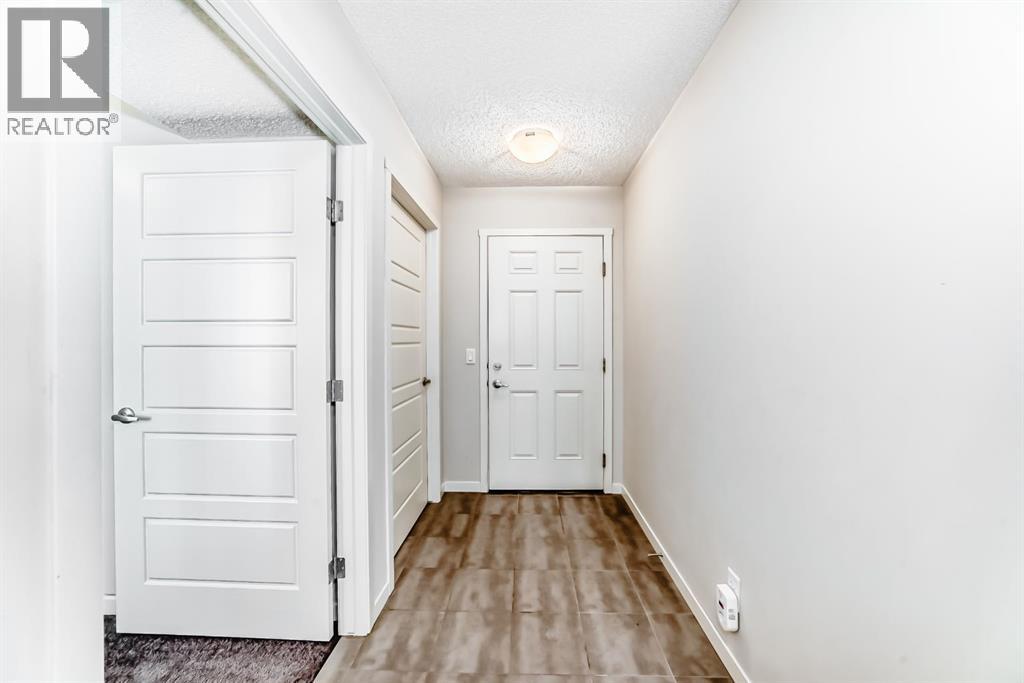 Row / Townhouse for Sale in 409 NOLANLAKE Villas NW|Calgary, Alberta T3R0Z7 3