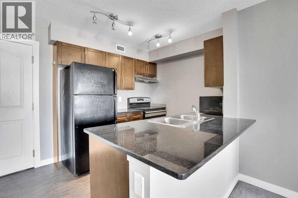 Apartment for Sale in 318, 7110 80 Avenue NE|Calgary, Alberta T3J0N4 2