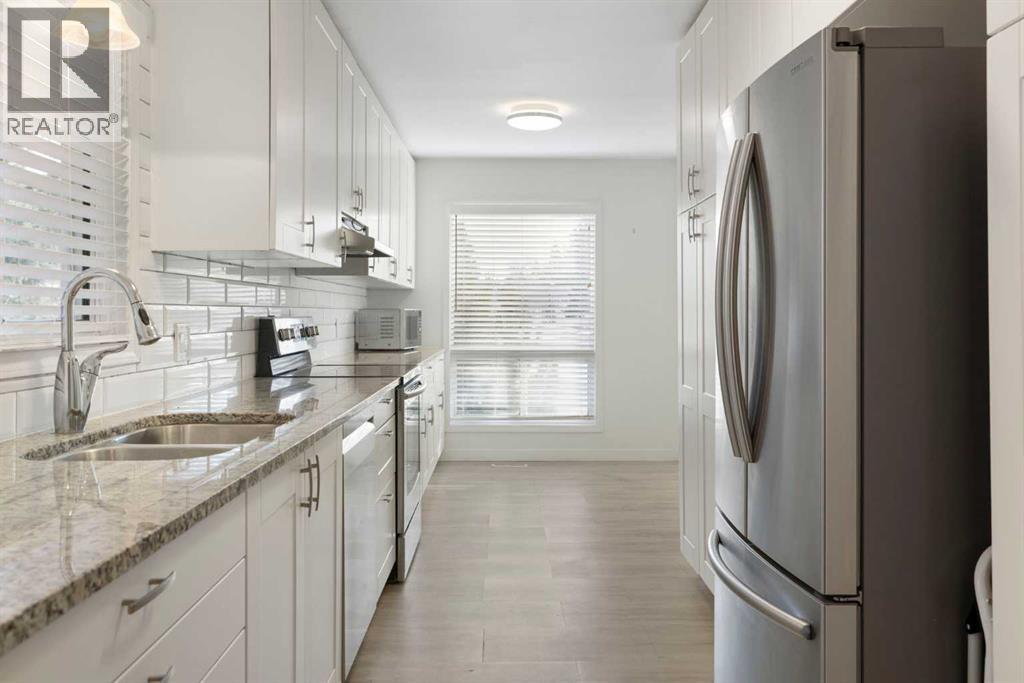 Row / Townhouse for Sale in 84 Deer Ridge Close SE|Calgary, Alberta T2J7C2 2