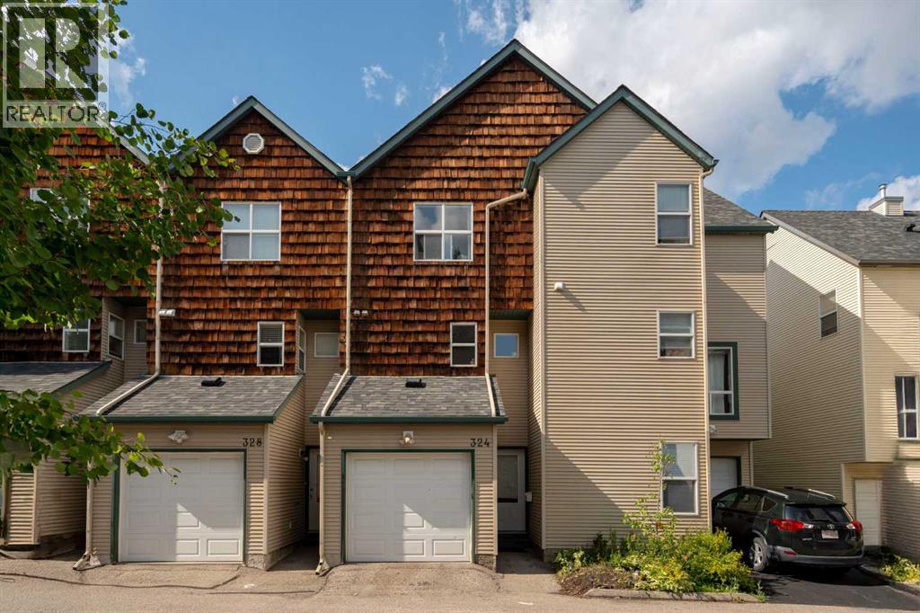 Row / Townhouse for Sale in 324 Bridlewood Lane SW|Calgary, Alberta T2Y3X8 2