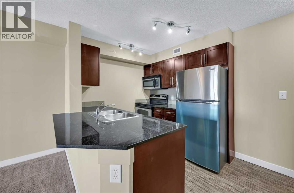 Apartment for Sale in 414, 7180 80 Avenue NE|Calgary, Alberta T3J0N6 4