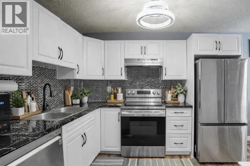 Row / Townhouse for Sale in 59, 4769 Hubalta Road SE|Calgary, Alberta T2B2N6 4