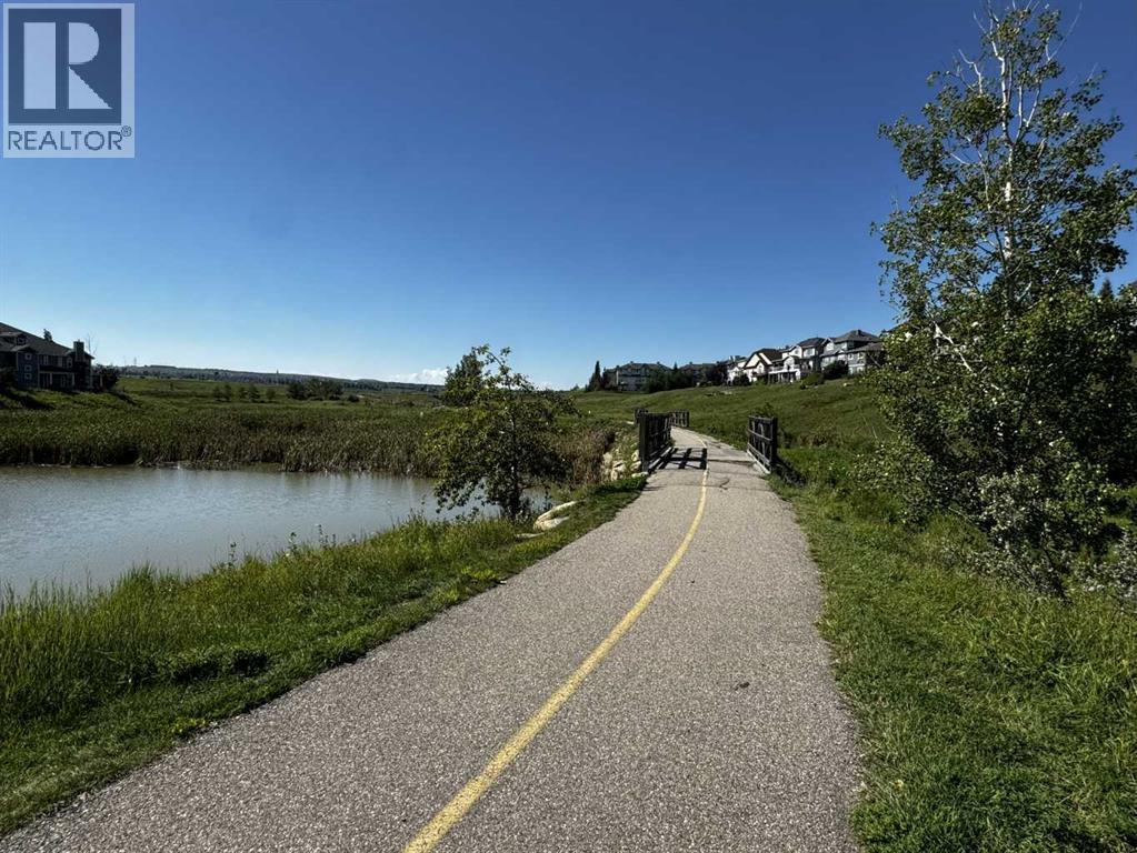 Row / Townhouse for Sale in 111 Hidden Creek Cove NW|Calgary, Alberta T3A6L8 2