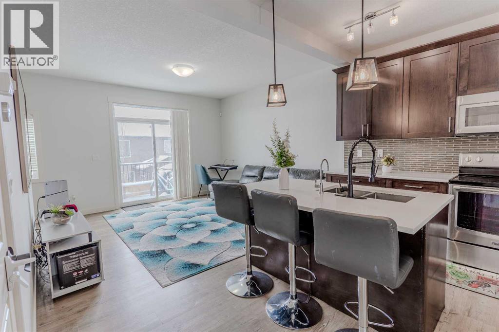 Row / Townhouse for Sale in 413, 355 Nolancrest Heights NW|Calgary, Alberta T3R0Z9 2