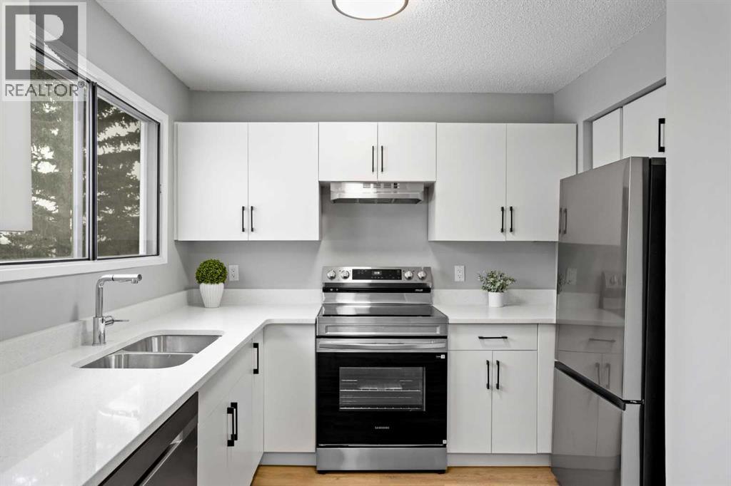 Row / Townhouse for Sale in 8, 6915 Ranchview Drive NW|Calgary, Alberta T3G1R8 2