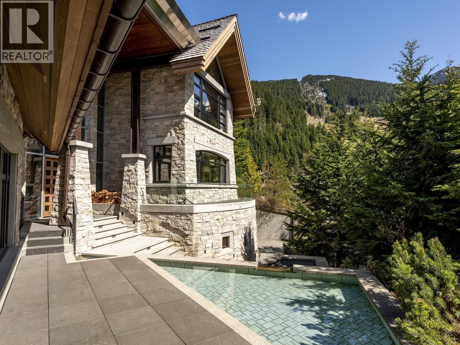 Spacious open-concept interior with natural light and mountain views