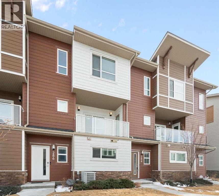 Row / Townhouse for Sale in 284 Harvest Hills Way NW|Calgary, Alberta T3K2P3