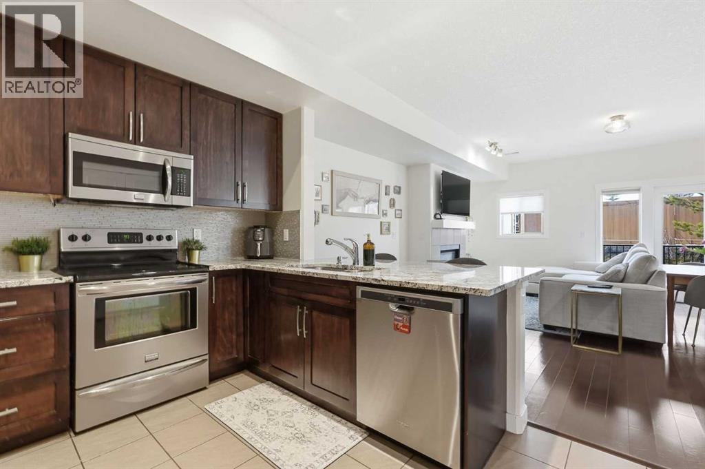 Row / Townhouse for Sale in 86 Cougar Ridge Landing SW|Calgary, Alberta T3H0X8 4