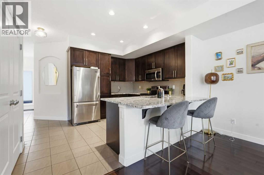 Row / Townhouse for Sale in 86 Cougar Ridge Landing SW|Calgary, Alberta T3H0X8 3