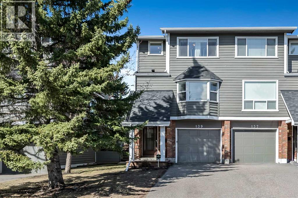 Row / Townhouse for Sale in 139 Woodglen Grove SW|Calgary, Alberta T2W4J9