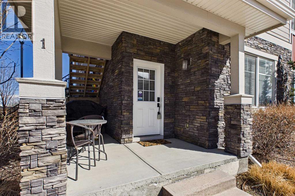 Row / Townhouse for Sale in 1, 67 West Coach Manor SW|Calgary, Alberta T3H1R7 2