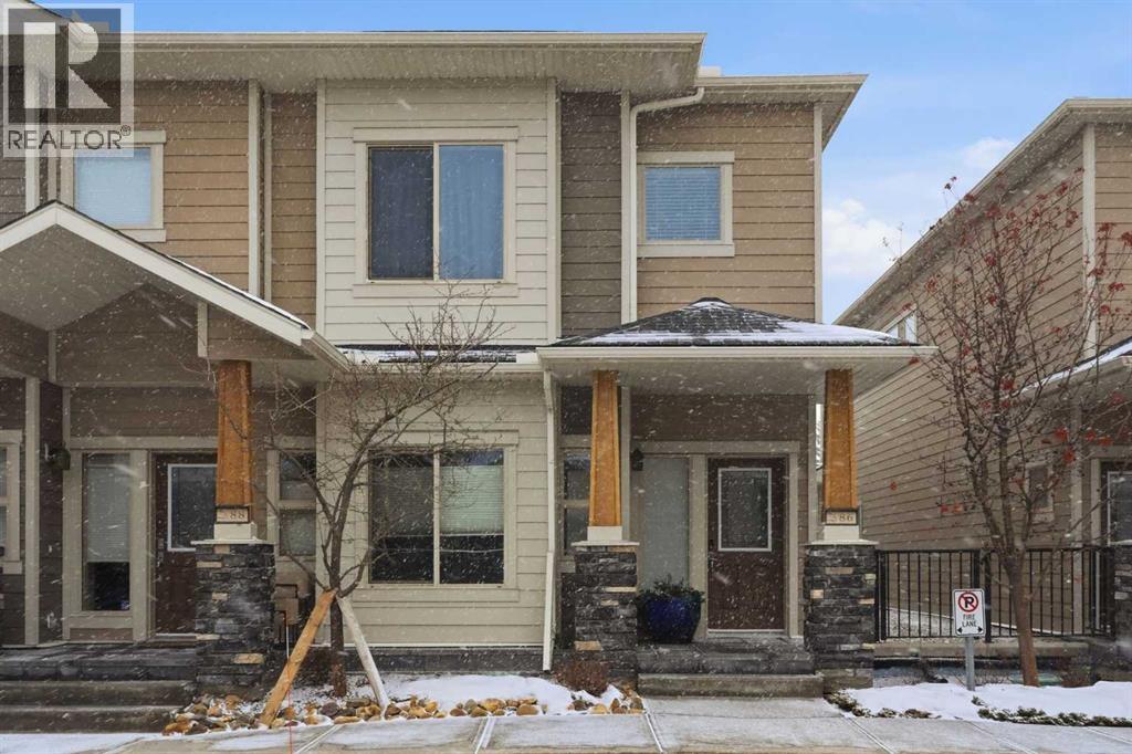 Row / Townhouse for Sale in 86 Cougar Ridge Landing SW|Calgary, Alberta T3H0X8