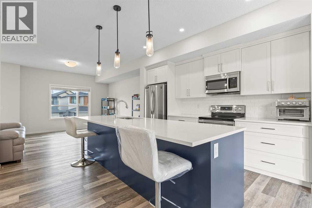 Row / Townhouse for Sale in 322 Harvest Hills Way NE|Calgary, Alberta T3K2P3