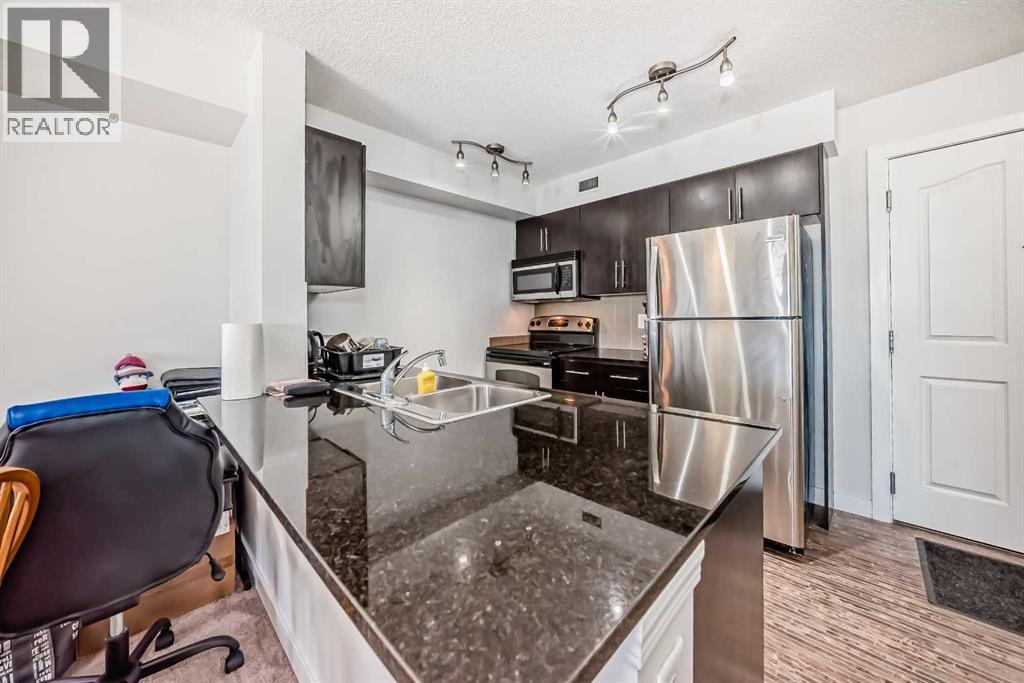 Apartment for Sale in 414, 7110 80 Avenue NE|Calgary, Alberta T3J0N4 5