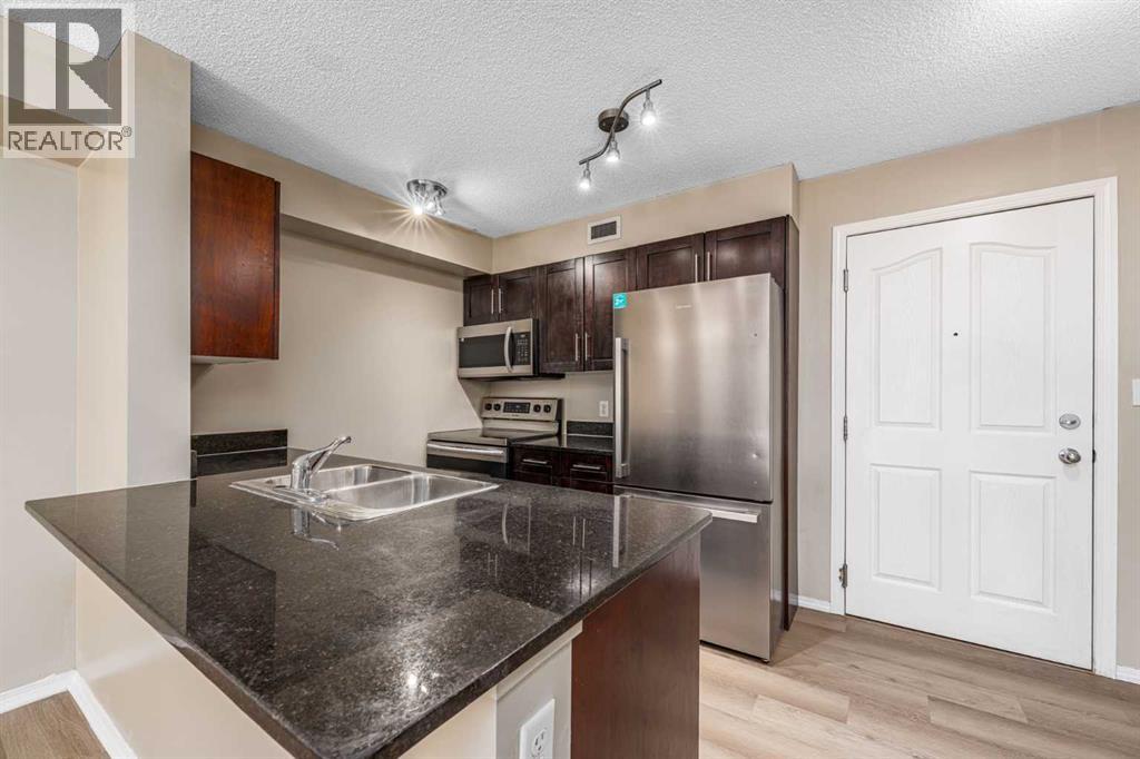 Apartment for Sale in 210, 7130 80 Avenue NE|Calgary, Alberta T3J0N5 4
