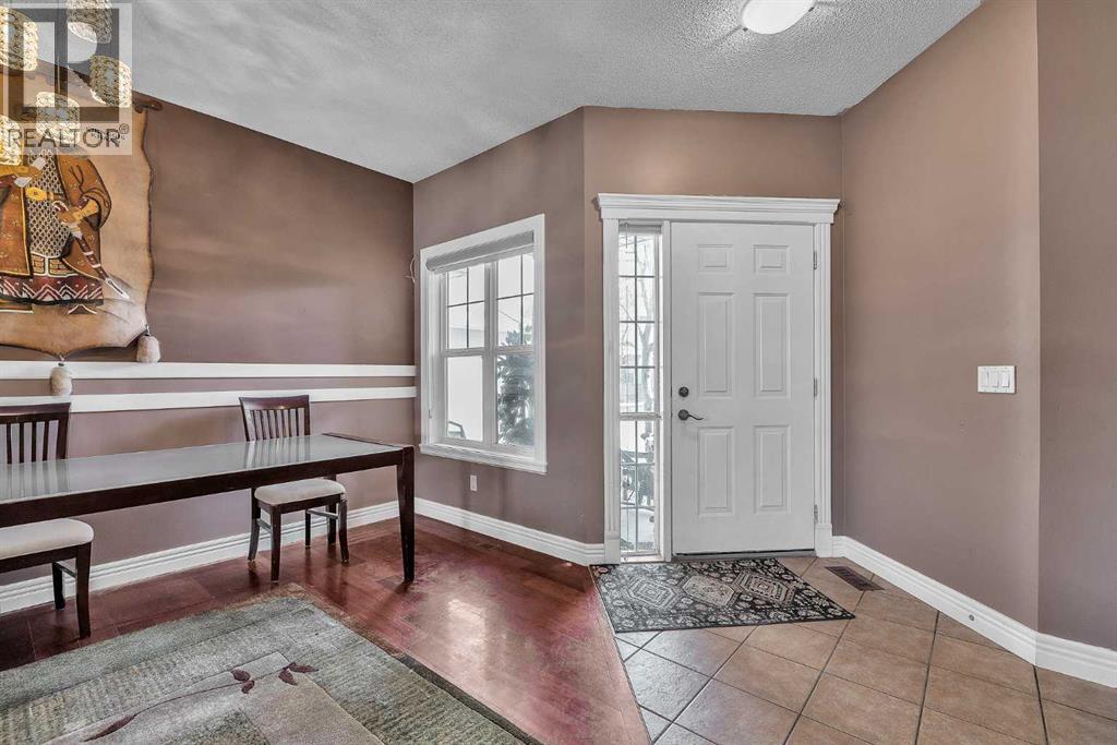 Row / Townhouse for Sale in 69, 39 Strathlea Common SW|Calgary, Alberta T3H5P8 2