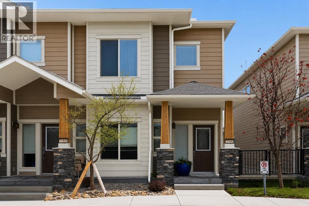 Row / Townhouse for Sale in 86 Cougar Ridge Landing SW|Calgary, Alberta T3H0X8