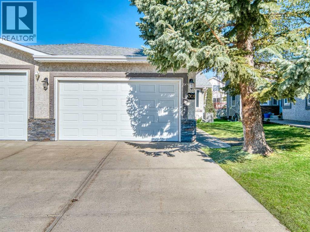 Duplex for Sale in 301 Arbour Cliff Close NW|Calgary, Alberta T3G3W8