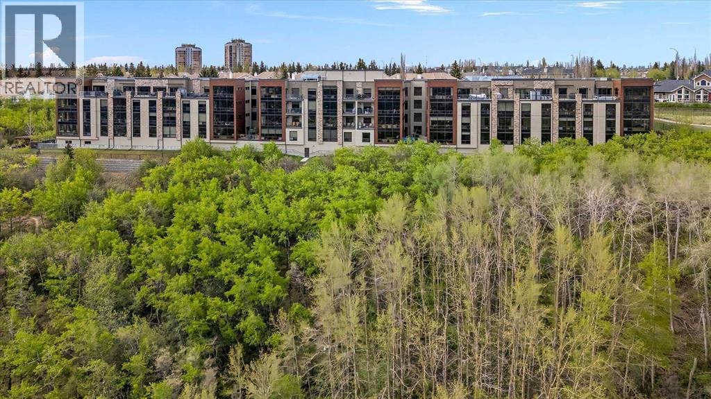 Apartment for Sale in 209, 15 Cougar Ridge Landing SW|Calgary, Alberta T3H6C3