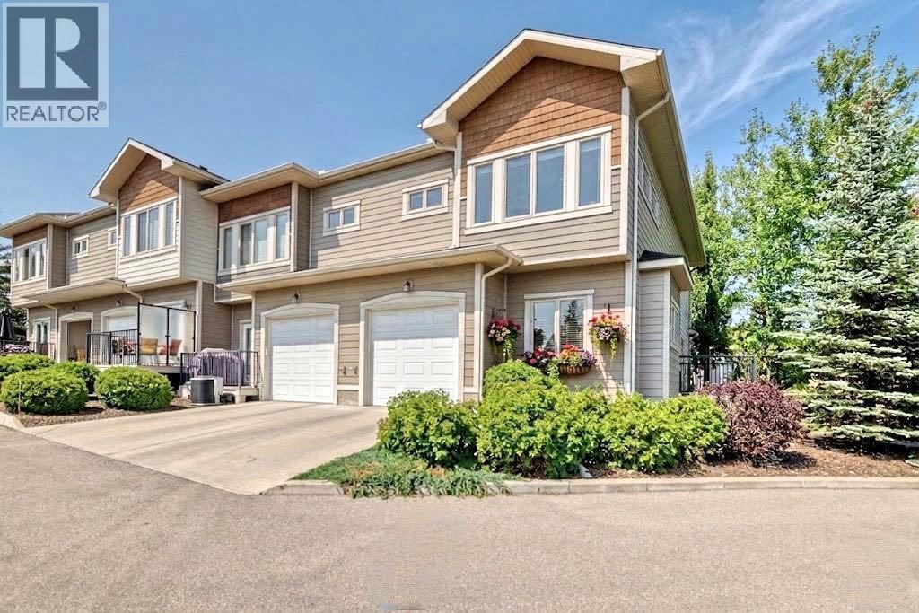 Row / Townhouse for Sale in 12 Cougar Ridge Landing SW|Calgary, Alberta T3H0X8