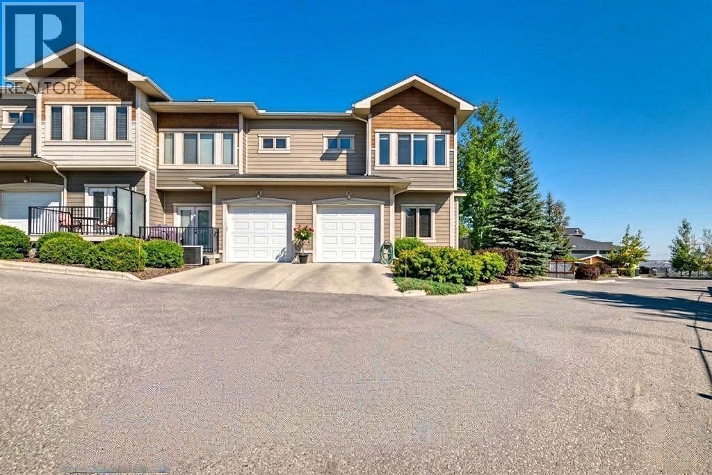 Row / Townhouse for Sale in 12 Cougar Ridge Landing SW|Calgary, Alberta T3H0X8 2