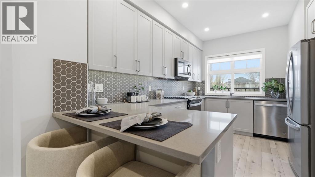 Row / Townhouse for Sale in 99 Les Jardins Park SE|Calgary, Alberta T2C5V3