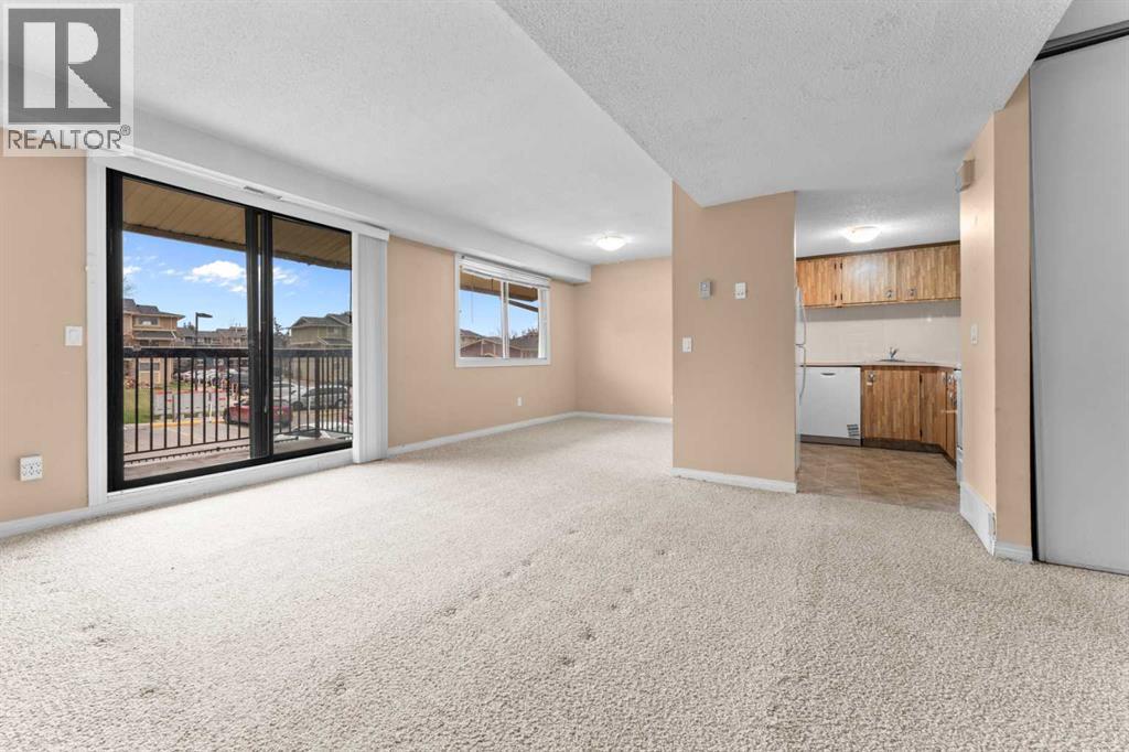 Row / Townhouse for Sale in 1202, 2200 Woodview Drive SW|Calgary, Alberta T2W3N6 2