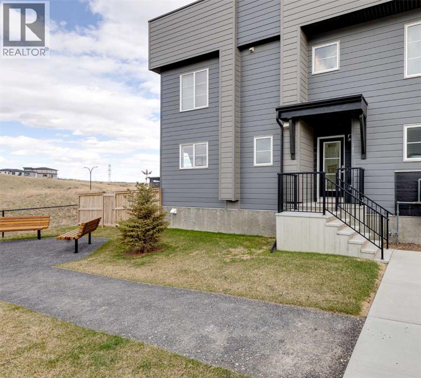 Row / Townhouse for Sale in 302, 260 Rowley Way NW|Calgary, Alberta T3L0H5 2