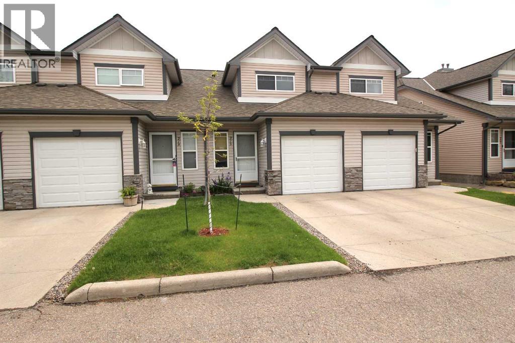 Row / Townhouse for Sale in 215 Millview Green SW|Calgary, Alberta T2Y3W1