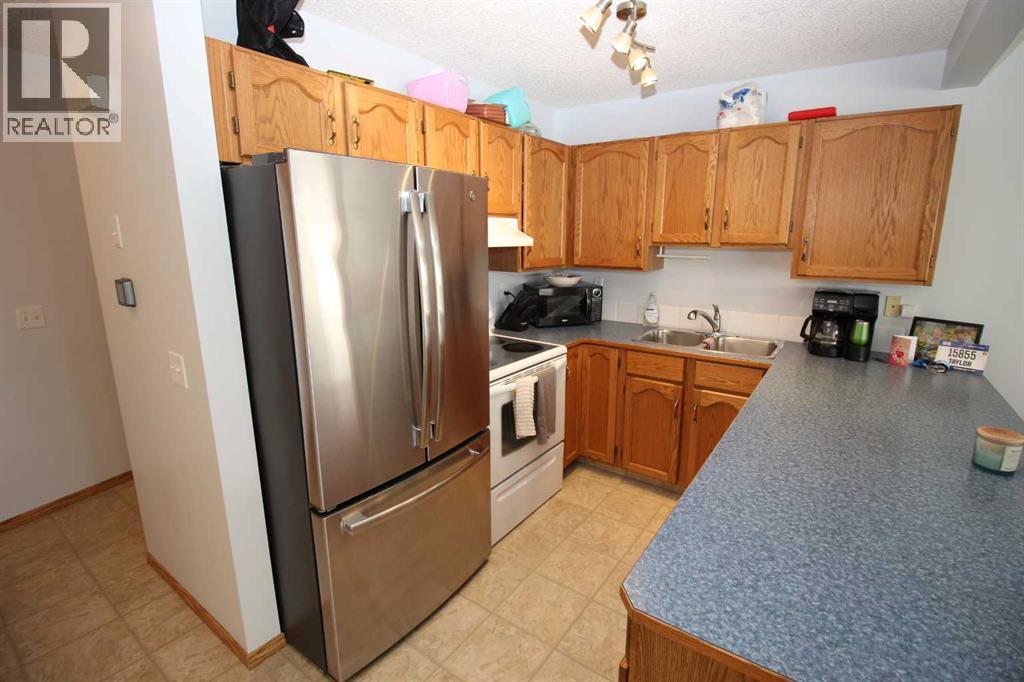 Row / Townhouse for Sale in 215 Millview Green SW|Calgary, Alberta T2Y3W1 2