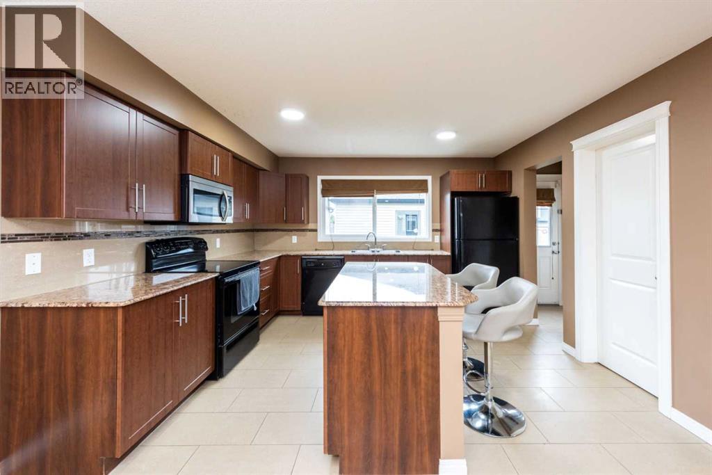Duplex for Sale in 212 Panatella Drive NW|Calgary, Alberta T3K0T4 2