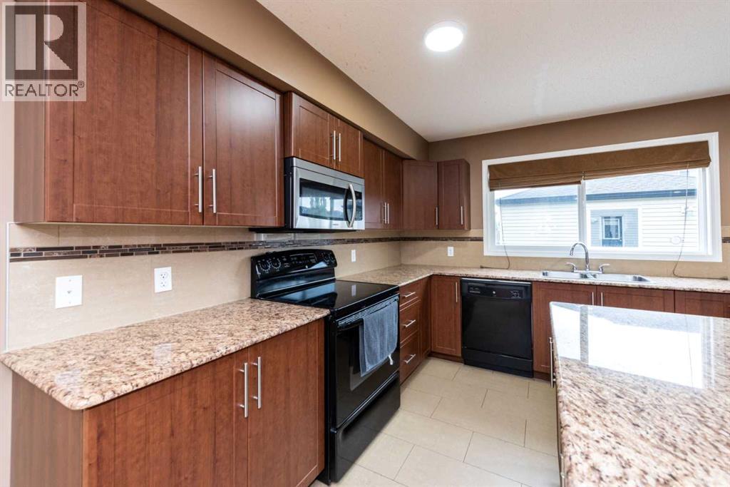 Duplex for Sale in 212 Panatella Drive NW|Calgary, Alberta T3K0T4 3
