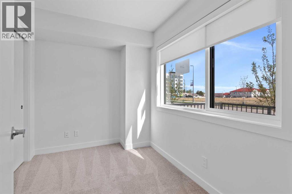 Row / Townhouse for Sale in 132 Quesnay Wood Link SW|Calgary, Alberta T3E8H6 4
