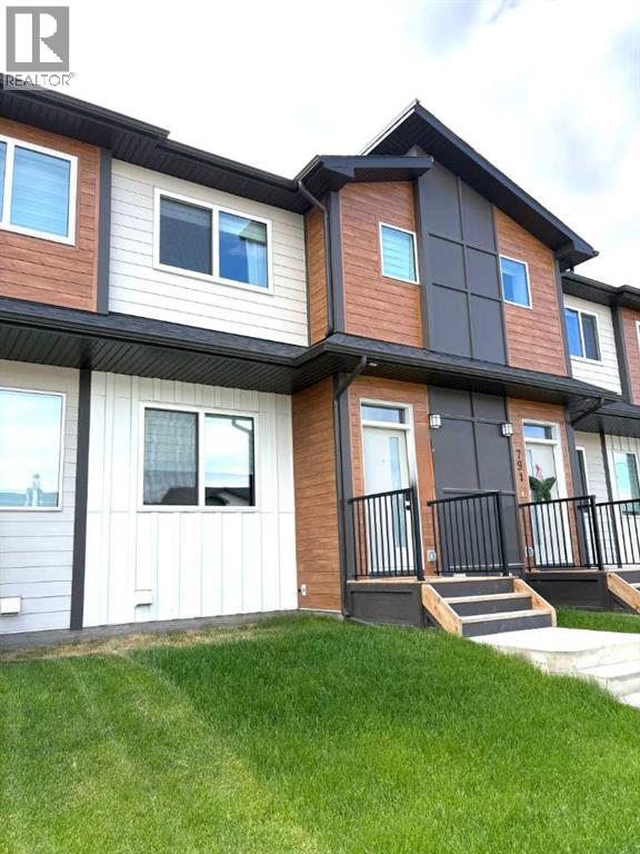 Row / Townhouse for Sale in 319 Wolf River Drive SE|Calgary, Alberta T2X6G6