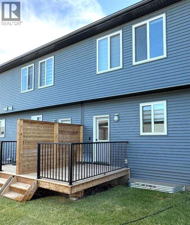 Row / Townhouse for Sale in 319 Wolf River Drive SE|Calgary, Alberta T2X6G6 2