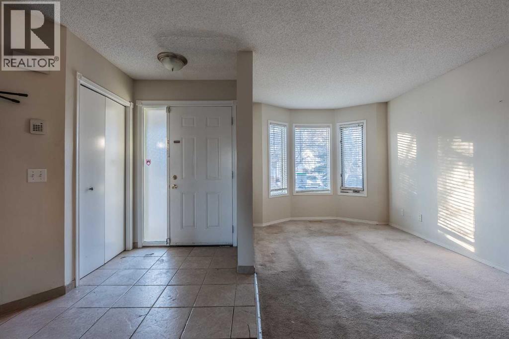 Row / Townhouse for Sale in 68 Abbeydale Villas NE|Calgary, Alberta T2A7P6 2