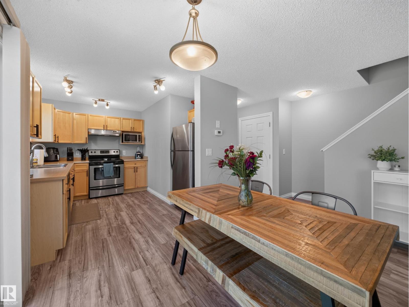 Kitchen from the dining area, pendant over the harvest table