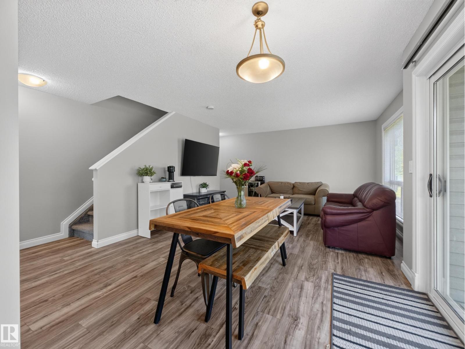 Dining, living and the stairs seen from the kitchen