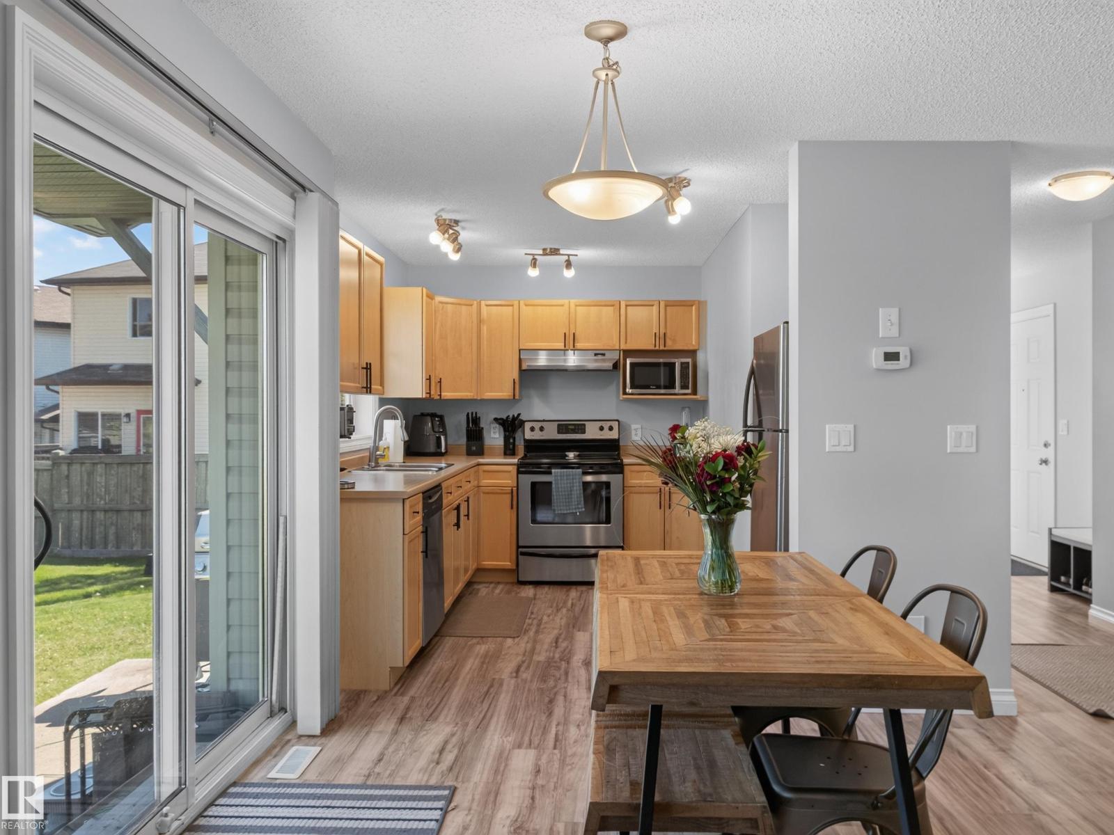 Patio door with the kitchen and dining area