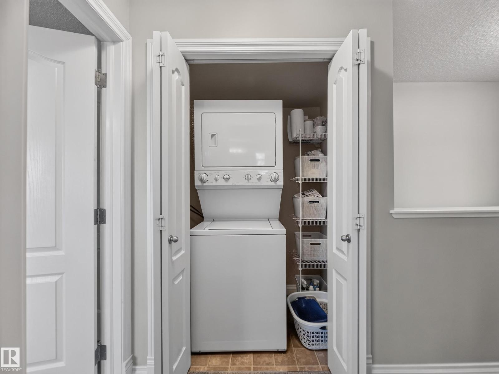 Upstairs laundry — stacked washer and dryer closet