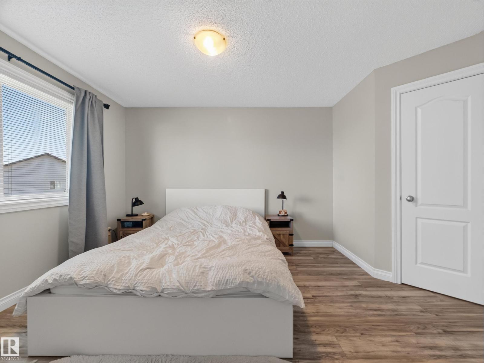 Second bedroom with bed and window