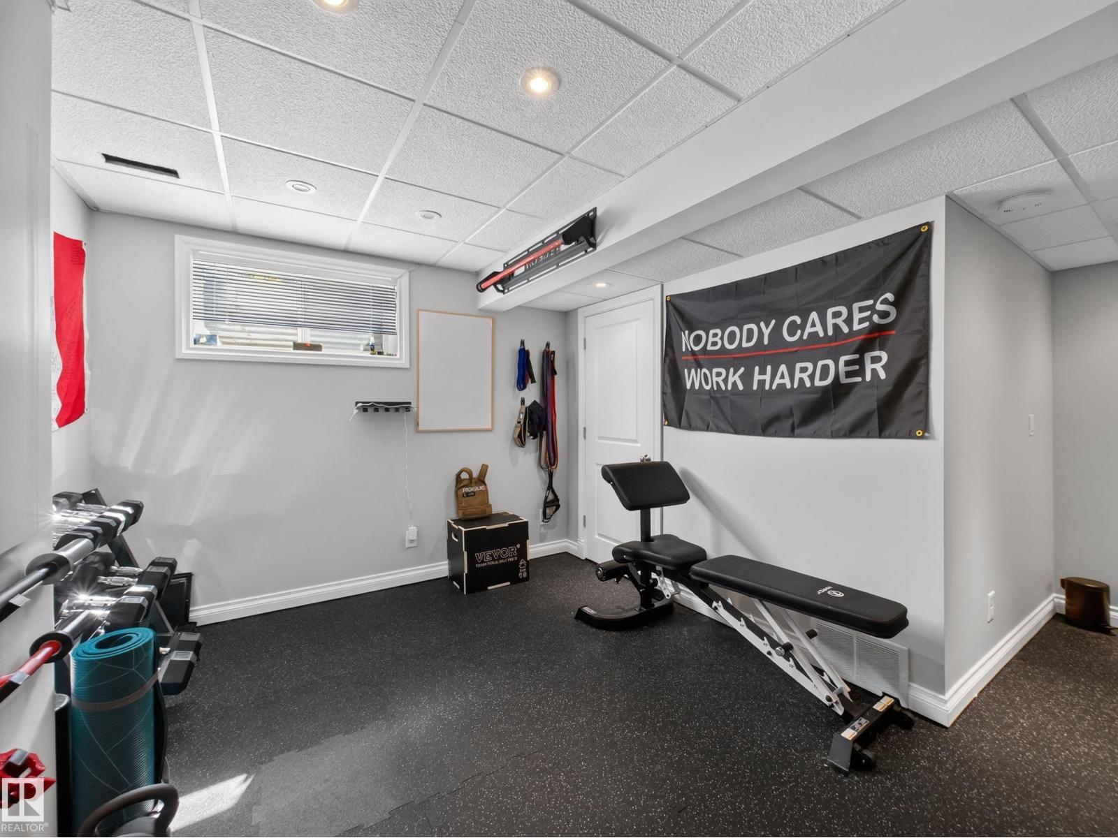 Basement gym wide with bench and window