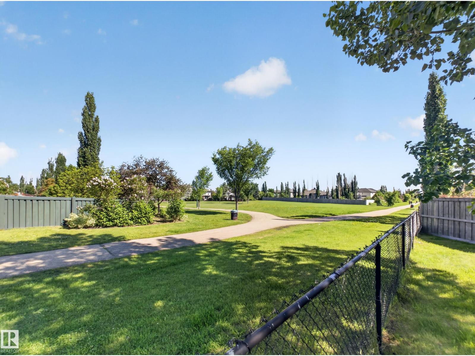 Green space and walking path beyond the back fence