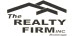 THE REALTY FIRM INC. logo